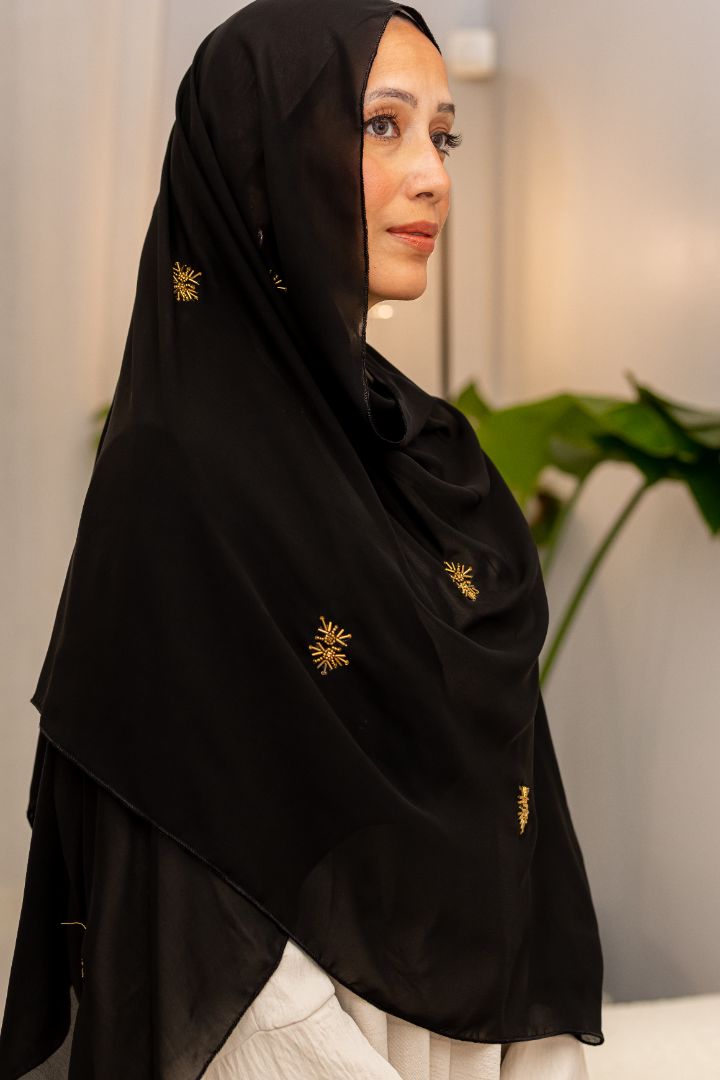 Luxury black chiffon hijab with gold bead embroidery, designed by Zoya Z for elegant modest fashion styling.