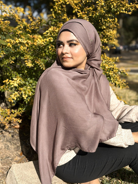 Mushroom modal hijab with soft, flowing drape and lightweight breathable fabric, styled outdoors for everyday modest wear