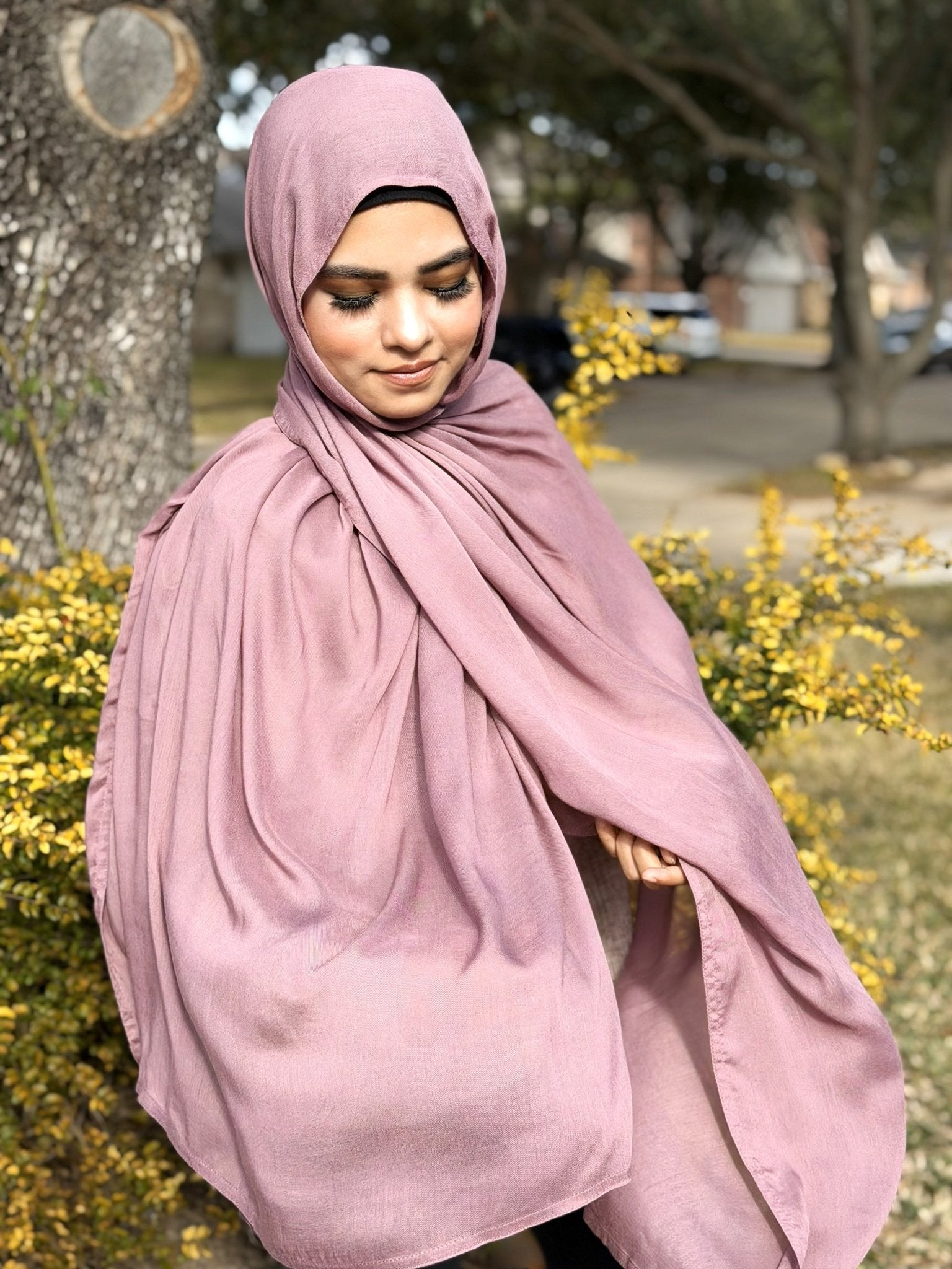 Lilac modal hijab with soft drape and lightweight breathable fabric, styled outdoors for everyday modest wear