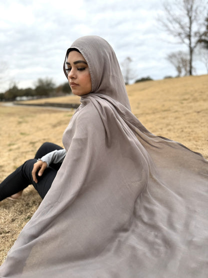 Soft gray modal hijab featuring lightweight, airy fabric and smooth drape, comfortable non-slip wrap for daily wear