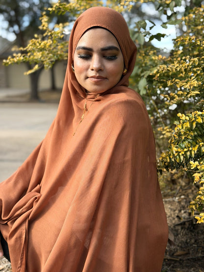 Burnt modal hijab featuring fluid drape and soft finish, lightweight and breathable for daily modest wear