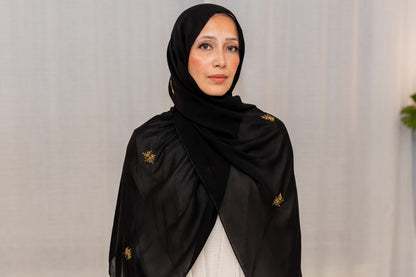 Luxury black chiffon hijab with gold bead embroidery, designed by Zoya Z for elegant modest fashion styling.