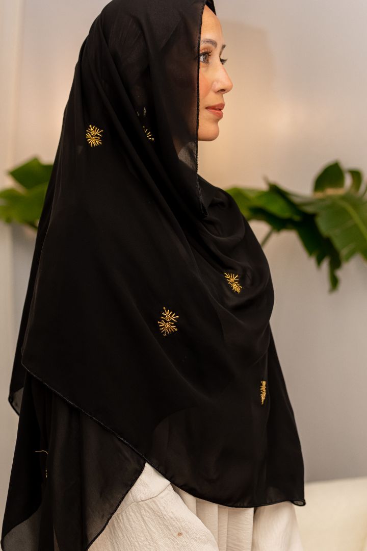 Luxury black chiffon hijab with gold bead embroidery, designed by Zoya Z for elegant modest fashion styling.