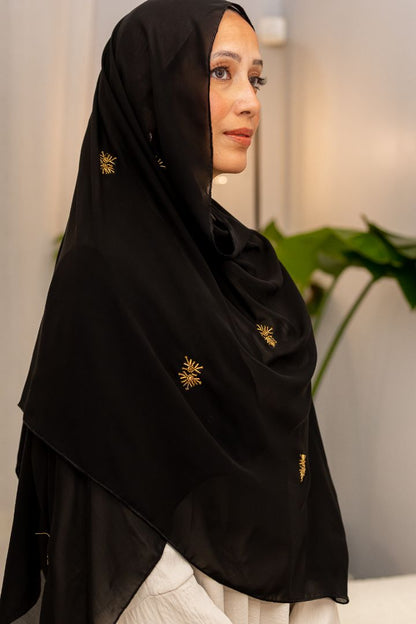 Luxury black chiffon hijab with gold bead embroidery, designed by Zoya Z for elegant modest fashion styling.