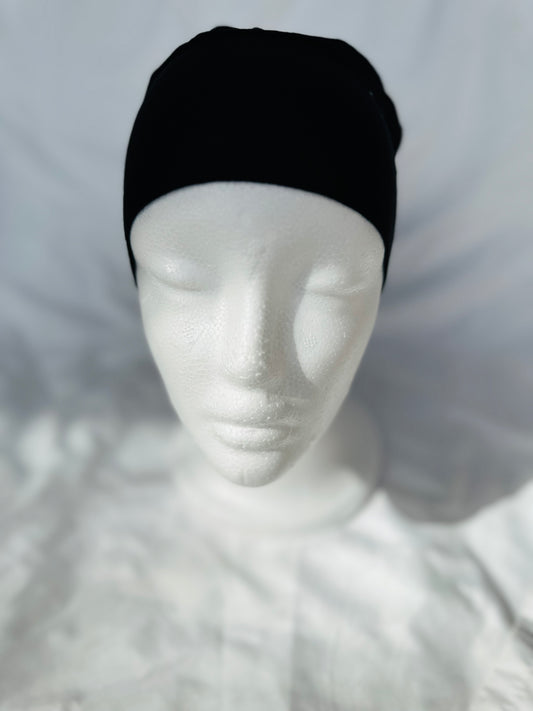 Black hijab undercap made from breathable jersey fabric, designed by Zoya Z for a secure, comfortable fit under all styles.