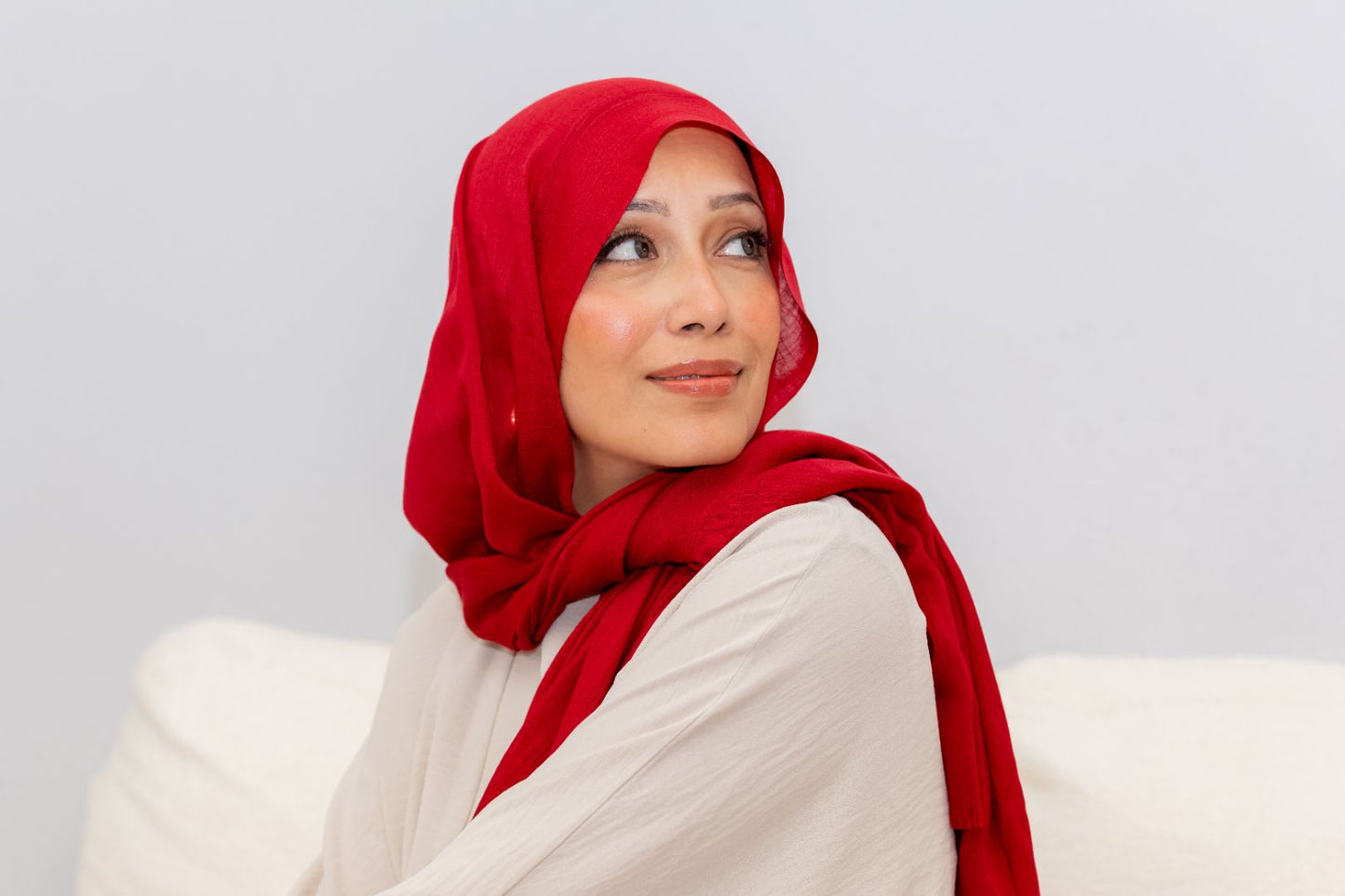Luxury red rayon hijab with soft drape and breathable texture, designed by Zoya Z for elegant modest fashion styling.