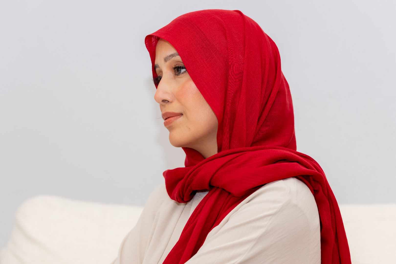 Luxury red rayon hijab with soft drape and breathable texture, designed by Zoya Z for elegant modest fashion styling.